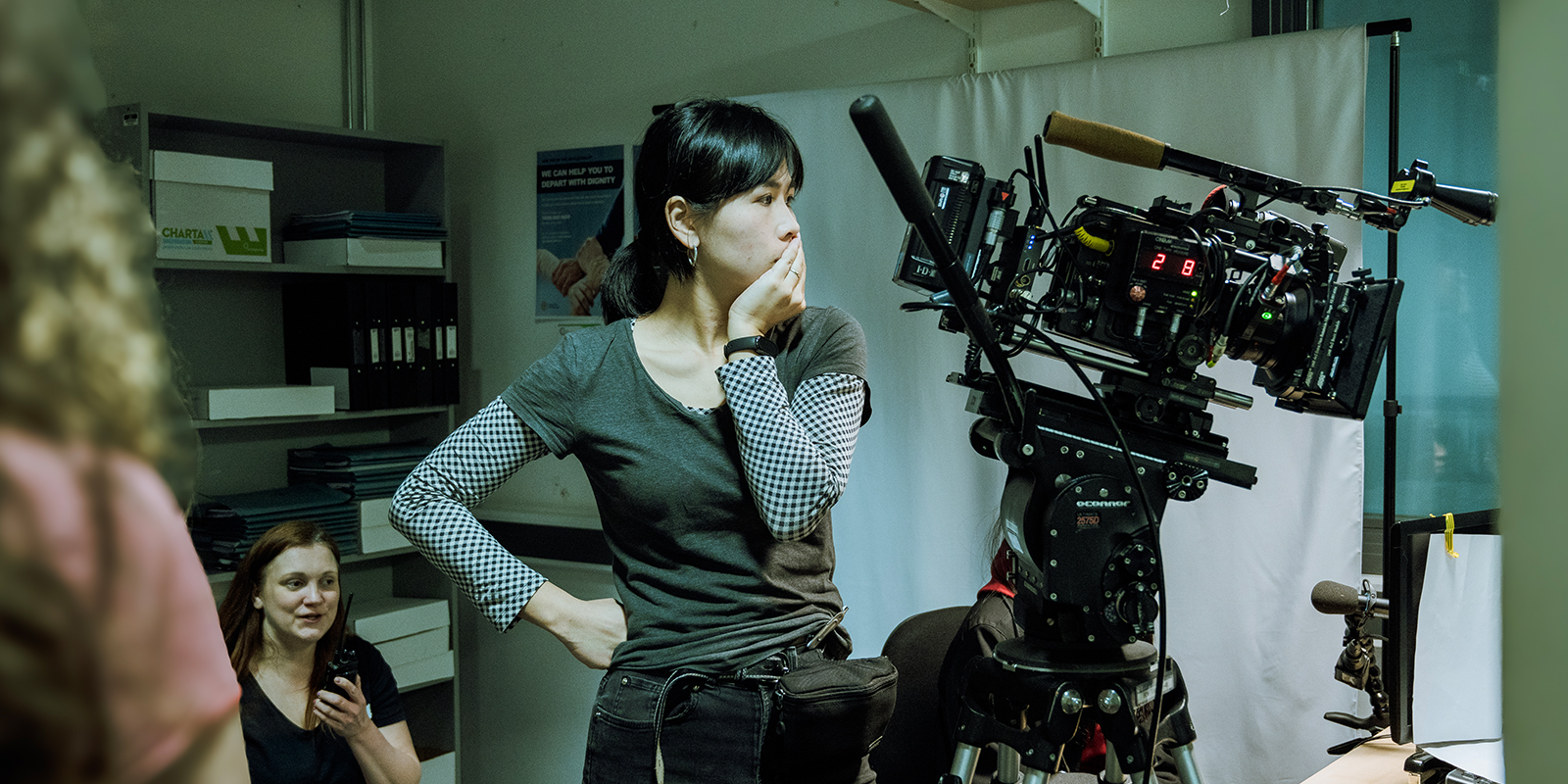 Sunshine on set with head in hand