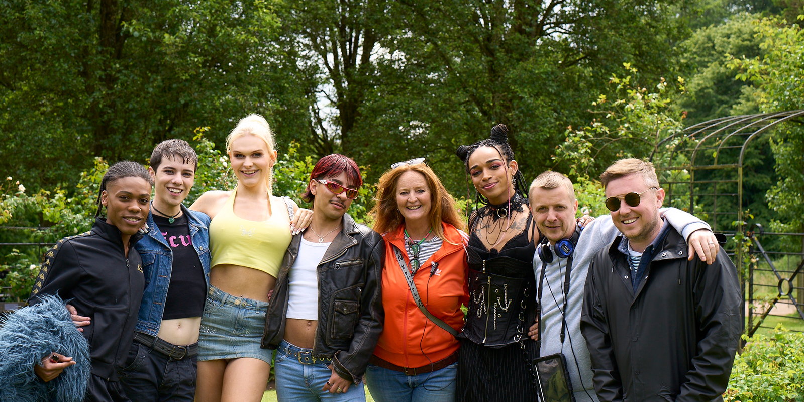 Cast and crew smiling together